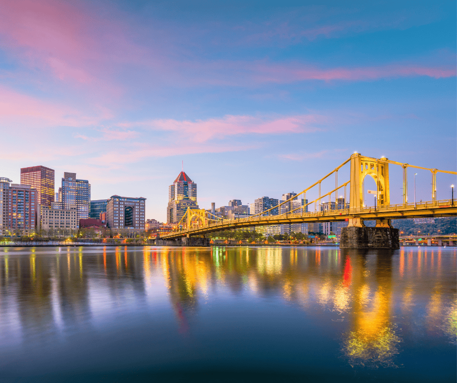a view of pittsburgh and one of its famous bridges - the good drop offers ketamine therapy for pittsburgh residents